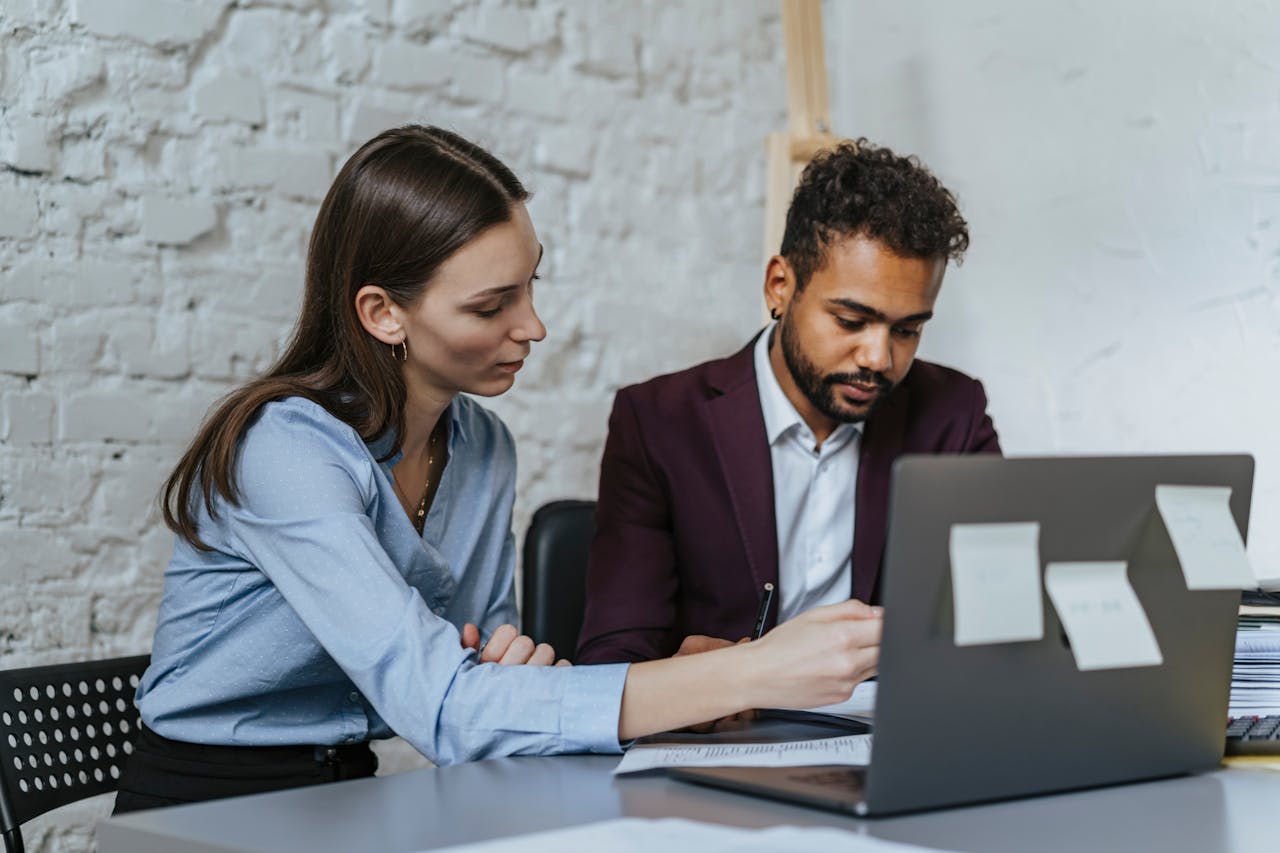 about-us Focused business professionals collaborating in a modern office environment.